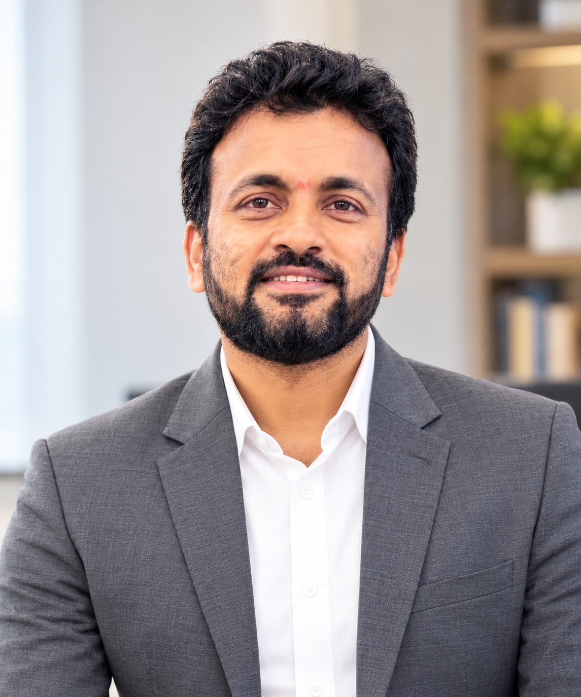 Professional portrait of Dr. E. Maruthi Prasad, Ph.D., Clinical Biochemist and Biomedical Researcher.